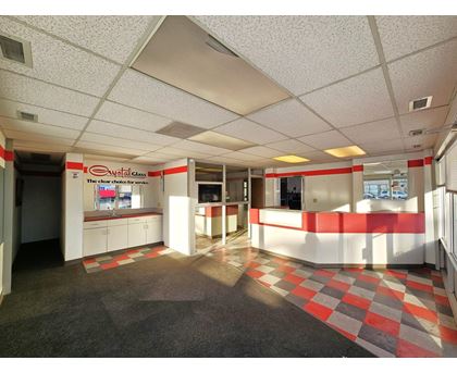 A room with a checkered floor and a white ceiling.