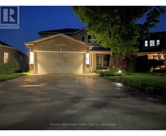 A house with a lit up driveway at night.