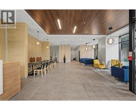 A modern office space with a long table and chairs.