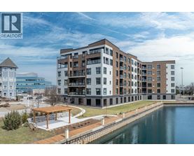 A large building with a body of water in front of it.