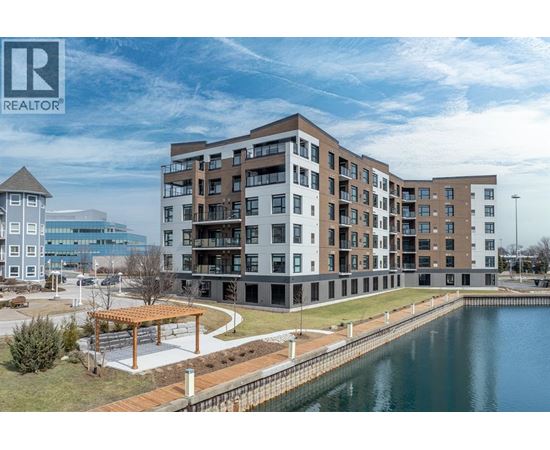 A large building with a body of water in front of it.