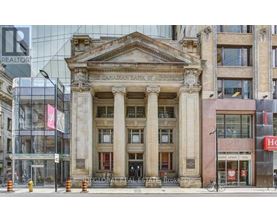 A building with a large entrance and pillars.