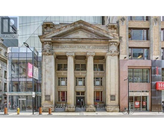 A building with a large entrance and pillars.