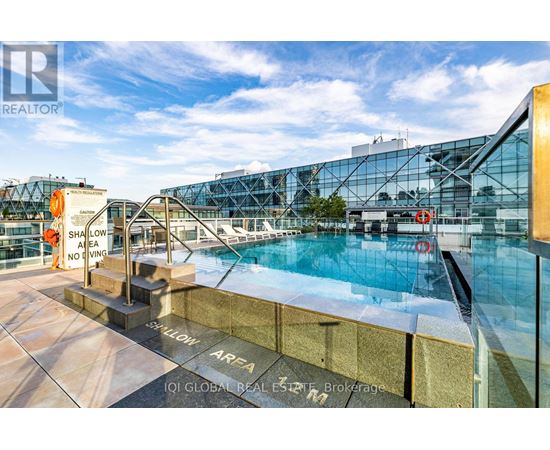 A pool area with a sign that says "SWIMMING AREA NO DIVING".