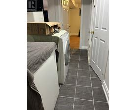 A laundry room with a washer and dryer.
