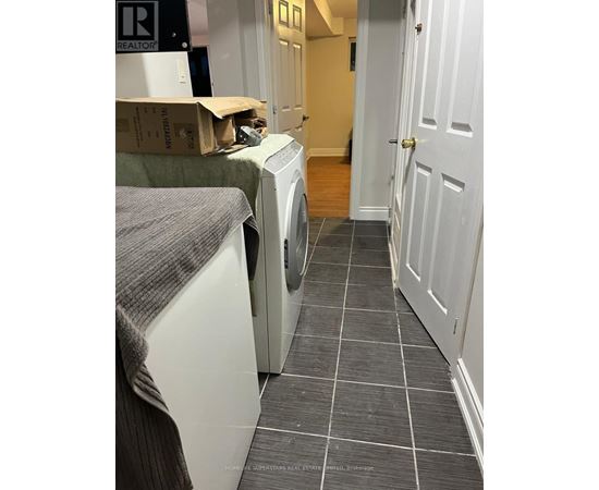 A laundry room with a washer and dryer.
