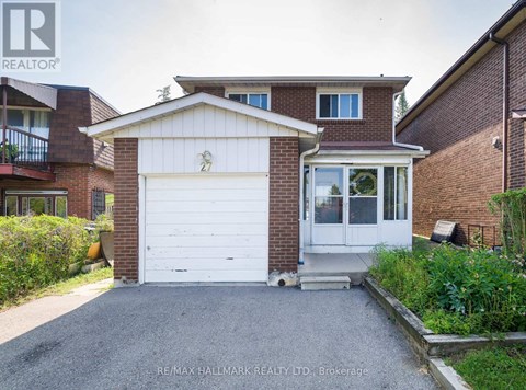 A two-story house with a garage is for sale.