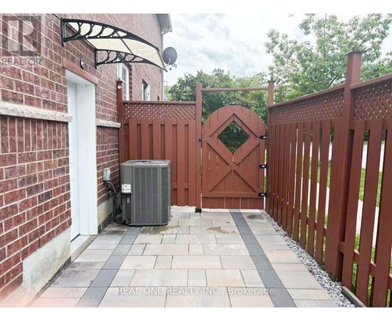 A red gate with a diamond pattern in the middle is closed.
