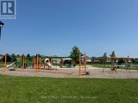 A playground with a slide, swings and climbing frame.