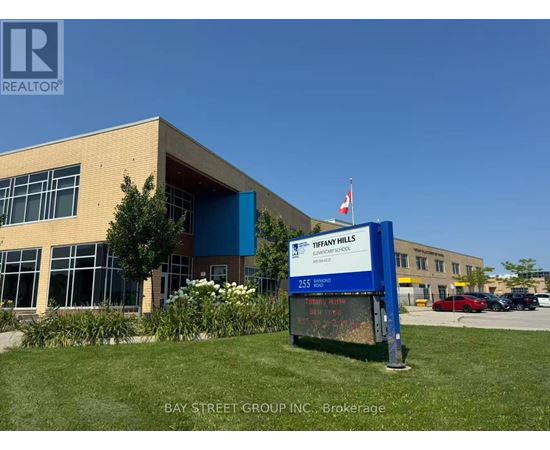 A sign in front of a building that says Tiffany Hills Elementary School.