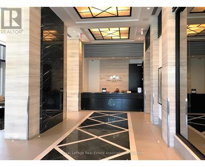 A reception area with a black and white checkered floor.