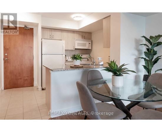 A modern kitchen with a glass table and chairs.