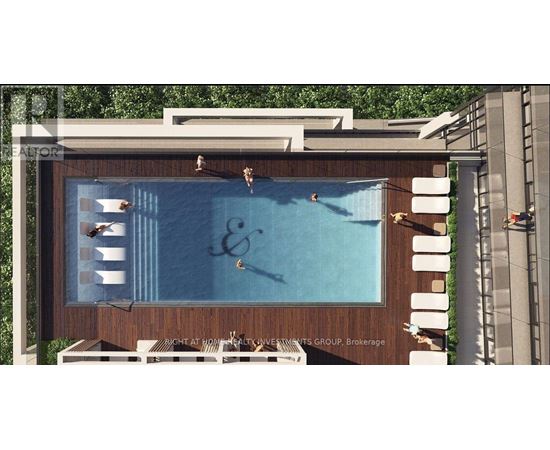 A large outdoor swimming pool with a wooden deck and lounge chairs.