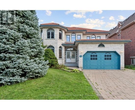 A house with a blue garage door is for sale.