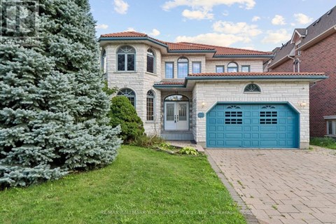 A house with a blue garage door is for sale.