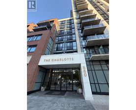 The Charlotte building is a modern structure with a glass facade and a brick exterior.