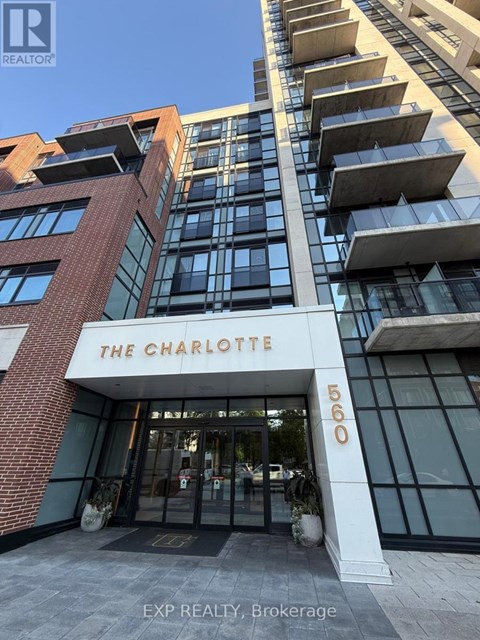 The Charlotte building is a modern structure with a glass facade and a brick exterior.