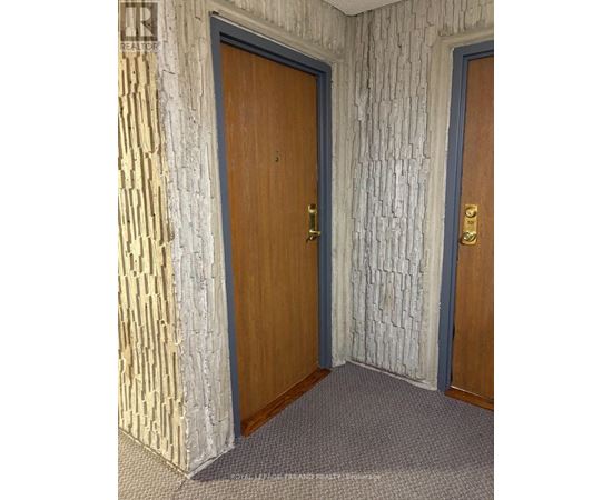 A room with two doors, one of which is closed.