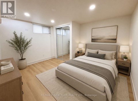 A bedroom with a large bed, a nightstand, and a plant.