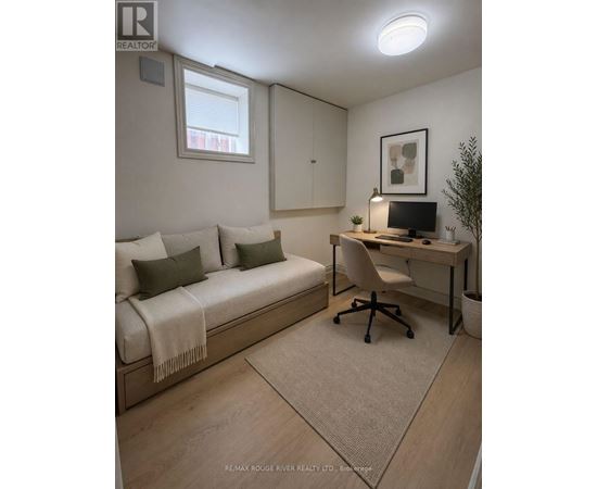 A cozy bedroom with a bed, desk, and chair.