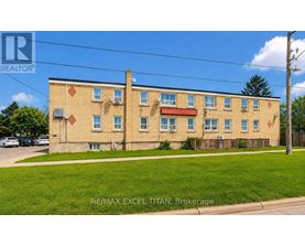 A building with the text RE/MAX EXCEL TITAN, Brokerage on it.