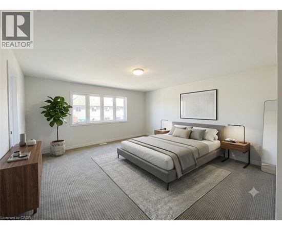 A well-lit bedroom with a large bed and a potted plant.