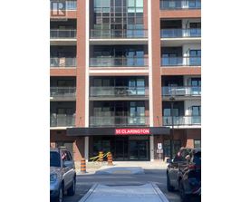 A building with the sign 55 Clarington in front of it.
