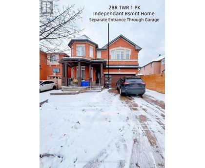 A house with a separate entrance through a garage is for sale.
