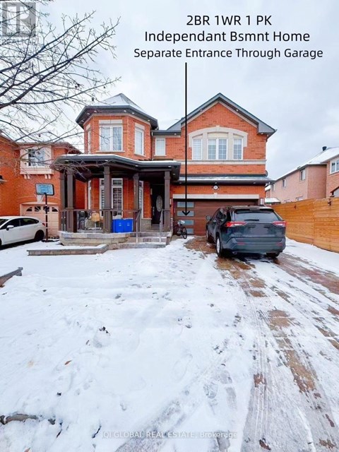 A house with a separate entrance through a garage is for sale.