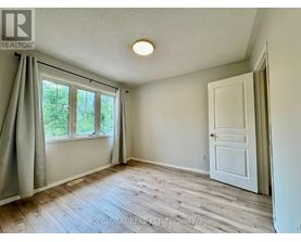 A room with a window and a door is shown.