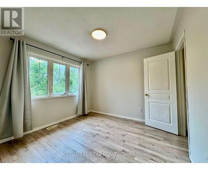 A room with a window and a door is shown.