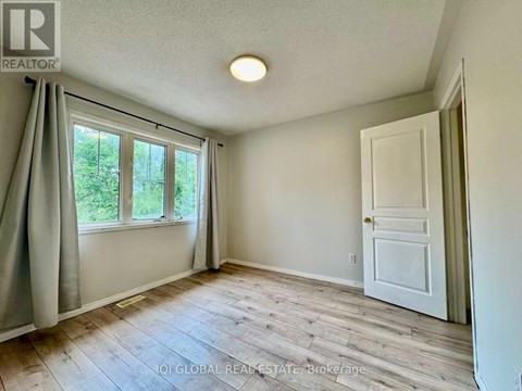A room with a window and a door is shown.