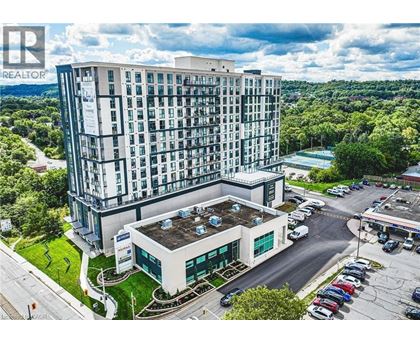 A large building with a parking lot in front of it.
