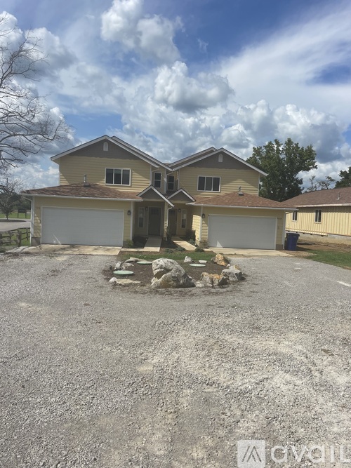 A house with a driveway in front of it.
