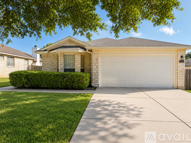 A house with a garage is for sale.