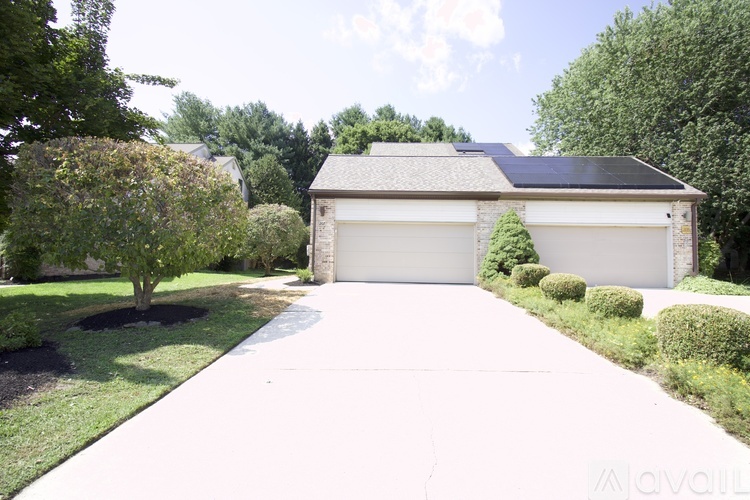 A house with a driveway and a garage door.