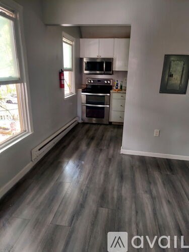 A kitchen with a stove top oven and a microwave.