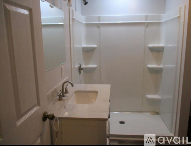 A bathroom with a sink and a toilet.