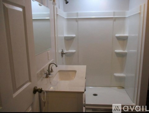 A bathroom with a sink and a toilet.