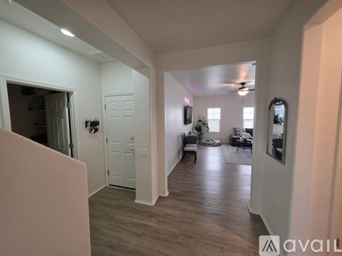 A spacious living room with a couch and a television.