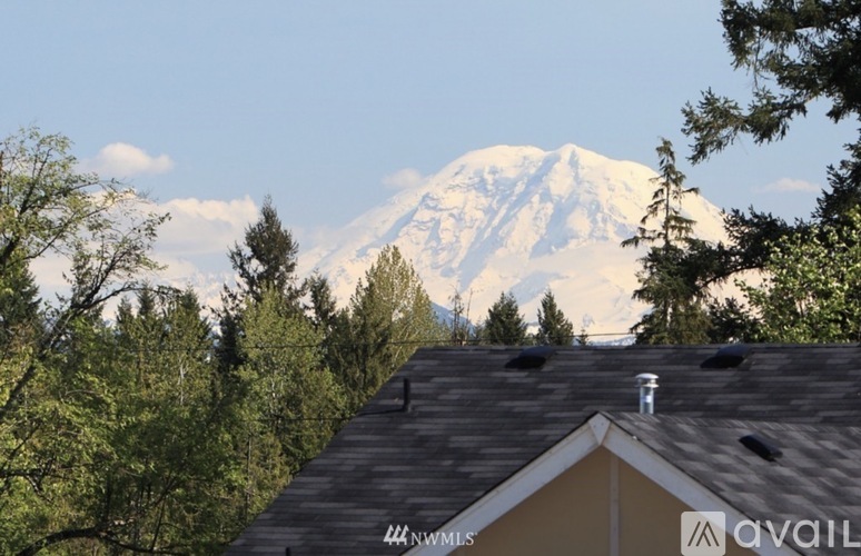 A house with a mountain in the background.