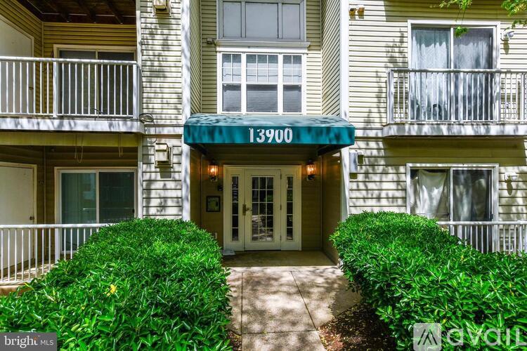 The image shows the front of a building with the number 13900 on it.