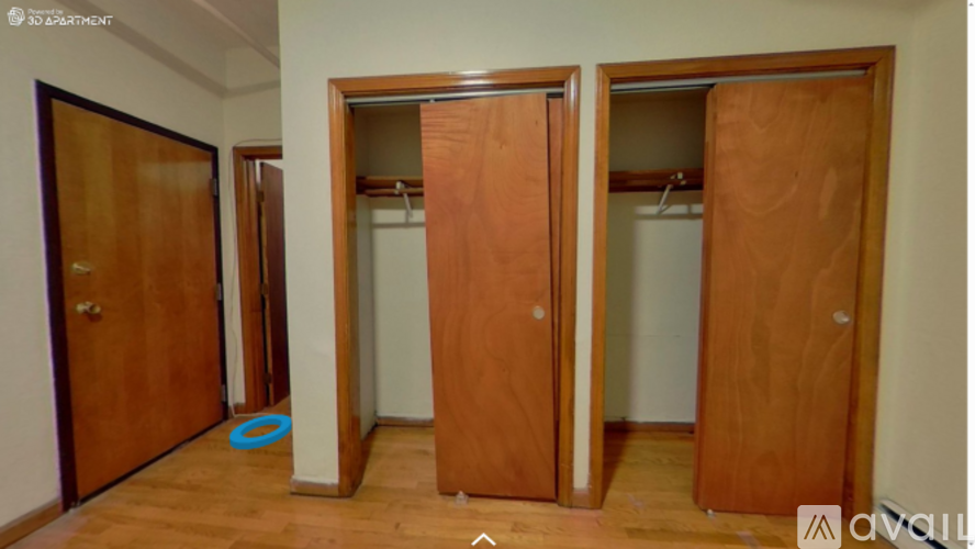 Three wooden doors are in a room.