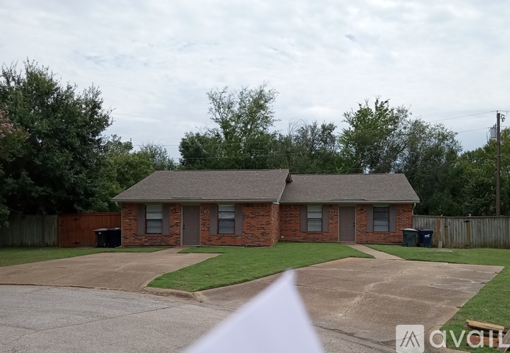 A house with a driveway in front of it.