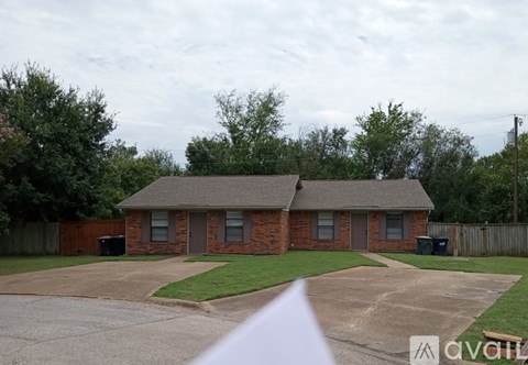 A house with a driveway in front of it.