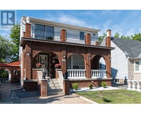 A house with a red brick porch and white trim.