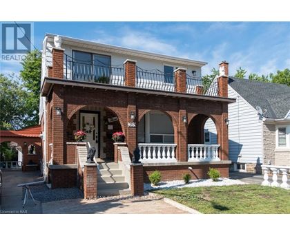 A house with a red brick porch and white trim.