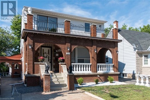 A house with a red brick porch and white trim.