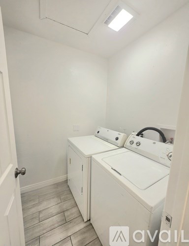 A laundry room with a washer and dryer.