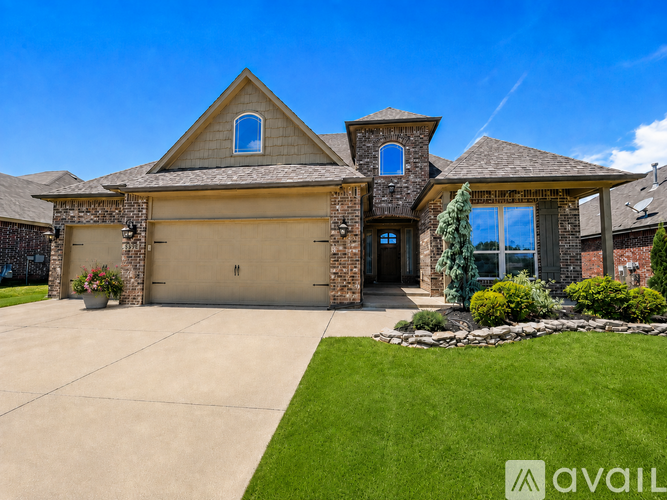 A house with a large front yard and a garage.
